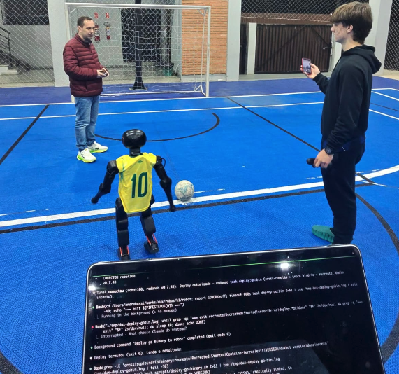 Field deploy: robot #10 on the futsal court while the deploy logs scroll on the laptop.