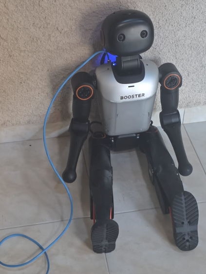 The Booster K1 during bring-up, tethered by an Ethernet cable.